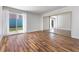 Bright bedroom with hardwood floors, sliding glass doors to the outside and mirrored closet doors at 2205 Sombrero Dr, Las Vegas, NV 89169
