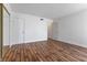 Spacious bedroom with hardwood floors and closet, ideal for relaxation and personal space at 2205 Sombrero Dr, Las Vegas, NV 89169