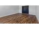 Bedroom with hardwood floors, ample space and a closet with bi-fold doors at 2205 Sombrero Dr, Las Vegas, NV 89169