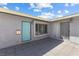 Inviting front entrance with a turquoise door, gray pavers, and neutral stucco walls at 2205 Sombrero Dr, Las Vegas, NV 89169