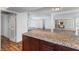 Open concept kitchen features granite counters and hardwood flooring, flowing into a spacious living area at 2205 Sombrero Dr, Las Vegas, NV 89169