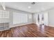 Bright living room featuring hardwood floors and expansive glass block windows at 2205 Sombrero Dr, Las Vegas, NV 89169