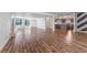 Spacious living room showcasing hardwood floors and an open layout connected to the kitchen at 2205 Sombrero Dr, Las Vegas, NV 89169