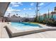 Backyard pool with lush desert landscaping and a rock waterfall feature at 2205 Sombrero Dr, Las Vegas, NV 89169
