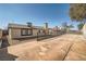 Expansive backyard featuring a concrete patio and desert landscaping, perfect for outdoor entertaining and relaxation at 239 Eugene Way, Henderson, NV 89015