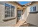 Covered front entrance featuring desert style facade, decorative touches and a secure screen door at 239 Eugene Way, Henderson, NV 89015