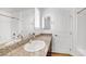 Bathroom featuring a granite countertop with a sink and ample cabinetry at 2843 Kona Blue Ln # 4, Las Vegas, NV 89183