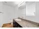 Bathroom featuring a granite countertop with a sink and dark cabinetry at 2843 Kona Blue Ln # 4, Las Vegas, NV 89183