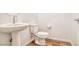 Bathroom featuring a pedestal sink and toilet at 2843 Kona Blue Ln # 4, Las Vegas, NV 89183