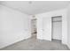 Carpeted bedroom featuring closet and doorway access to the laundry room at 2843 Kona Blue Ln # 4, Las Vegas, NV 89183