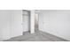 Bright, carpeted bedroom with closet and doorway at 2843 Kona Blue Ln # 4, Las Vegas, NV 89183