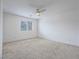Bedroom with carpet flooring, a ceiling fan and a window at 2843 Kona Blue Ln # 4, Las Vegas, NV 89183