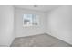 Well-lit bedroom with a large window and neutral carpeting at 2843 Kona Blue Ln # 4, Las Vegas, NV 89183