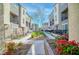 Tranquil courtyard featuring landscaped walkways and modern residential buildings at 2843 Kona Blue Ln # 4, Las Vegas, NV 89183