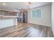 Bright dining area with contemporary lighting adjacent to the sleek kitchen at 2843 Kona Blue Ln # 4, Las Vegas, NV 89183