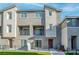 Multi-story units, each with fenced yards and multiple windows and balconies at 2843 Kona Blue Ln # 4, Las Vegas, NV 89183