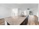 Open concept kitchen with granite countertops connects to the living area at 2843 Kona Blue Ln # 4, Las Vegas, NV 89183