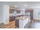 Modern kitchen with granite countertops, stainless steel appliances, and a center island at 2843 Kona Blue Ln # 4, Las Vegas, NV 89183