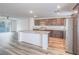 Well-lit kitchen featuring an island with granite countertops and stainless steel appliances at 2843 Kona Blue Ln # 4, Las Vegas, NV 89183