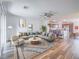 Bright, virtually staged living room with wood-look floors and an open-concept design at 2843 Kona Blue Ln # 4, Las Vegas, NV 89183