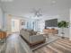 Staged living room with hardwood floors, modern furnishings, and a ceiling fan at 2843 Kona Blue Ln # 4, Las Vegas, NV 89183