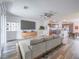 Bright, staged living room with modern furniture and an open concept kitchen at 2843 Kona Blue Ln # 4, Las Vegas, NV 89183