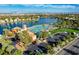 Aerial view of the community pool, parking and waterfront at 3125 N Buffalo Dr # 1133, Las Vegas, NV 89128