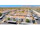 Aerial view of condo community featuring covered parking, lush landscaping, and scenic mountain backdrop at 3125 N Buffalo Dr # 1133, Las Vegas, NV 89128
