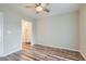 Inviting bedroom showcases wood-look floors and closet with custom shelving at 3125 N Buffalo Dr # 1133, Las Vegas, NV 89128