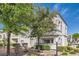 Apartment building exterior featuring lush landscaping and mature trees at 3125 N Buffalo Dr # 1133, Las Vegas, NV 89128