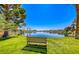 Beautiful lake view with bench and lush greenery, perfect for relaxing outdoors at 3125 N Buffalo Dr # 1133, Las Vegas, NV 89128