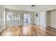 Bright and airy living room featuring wood floors and sliding glass door at 3125 N Buffalo Dr # 1133, Las Vegas, NV 89128