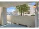 View from private covered patio overlooking lush landscaping and building facade at 3125 N Buffalo Dr # 1133, Las Vegas, NV 89128