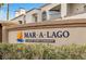 Community signage reading Mar-A-Lago, A Desert Shores Community, with well-maintained landscaping at 3125 N Buffalo Dr # 1133, Las Vegas, NV 89128