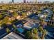 Las Vegas neighborhood aerial showcasing a pool and lush landscaping with the city skyline in the background at 3200 Bryant Ave, Las Vegas, NV 89102