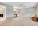 An open bedroom with a connected bathroom includes a vanity, a ceiling fan, and natural light at 3200 Bryant Ave, Las Vegas, NV 89102