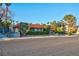 Single-story home showcasing mature landscaping and a well-maintained yard, complemented by a red tile roof at 3200 Bryant Ave, Las Vegas, NV 89102