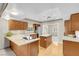 Bright kitchen with wood cabinets, an island, and stainless steel appliances at 3200 Bryant Ave, Las Vegas, NV 89102