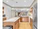 Spacious kitchen with stainless steel appliances and kitchen island overlooking the living room at 3200 Bryant Ave, Las Vegas, NV 89102