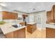 Bright kitchen with stainless steel appliances, a center island, and light-colored countertops at 3200 Bryant Ave, Las Vegas, NV 89102