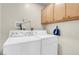 Laundry room with washer and dryer, overhead cabinets at 3200 Bryant Ave, Las Vegas, NV 89102