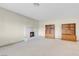 Cozy living room featuring a fireplace, carpeted floors, and built-in shelving at 3200 Bryant Ave, Las Vegas, NV 89102