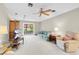 Spacious living room featuring a ceiling fan and sliding glass door to the backyard at 3200 Bryant Ave, Las Vegas, NV 89102