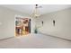 Open floor plan living room with modern lighting fixture and decorative sconces at 3200 Bryant Ave, Las Vegas, NV 89102