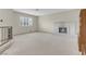 Open-concept living area with cozy fireplace, neutral tones, and ample natural light, perfect for relaxation at 3200 Bryant Ave, Las Vegas, NV 89102