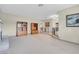 Bright living room with carpeted floors and built-in shelving at 3200 Bryant Ave, Las Vegas, NV 89102