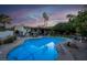 Inviting pool with lush backyard, perfect for relaxing and entertaining under the sunset at 3200 Bryant Ave, Las Vegas, NV 89102