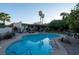 Inviting pool area surrounded by lush landscaping and palm trees, perfect for relaxation at 3200 Bryant Ave, Las Vegas, NV 89102