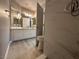 Bathroom boasting a walk-in shower with elegant marble-style tiles at 3340 Shallow Pond Dr, Las Vegas, NV 89117