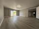 Empty bedroom featuring laminate flooring, recessed lighting, and sliding glass door at 3340 Shallow Pond Dr, Las Vegas, NV 89117